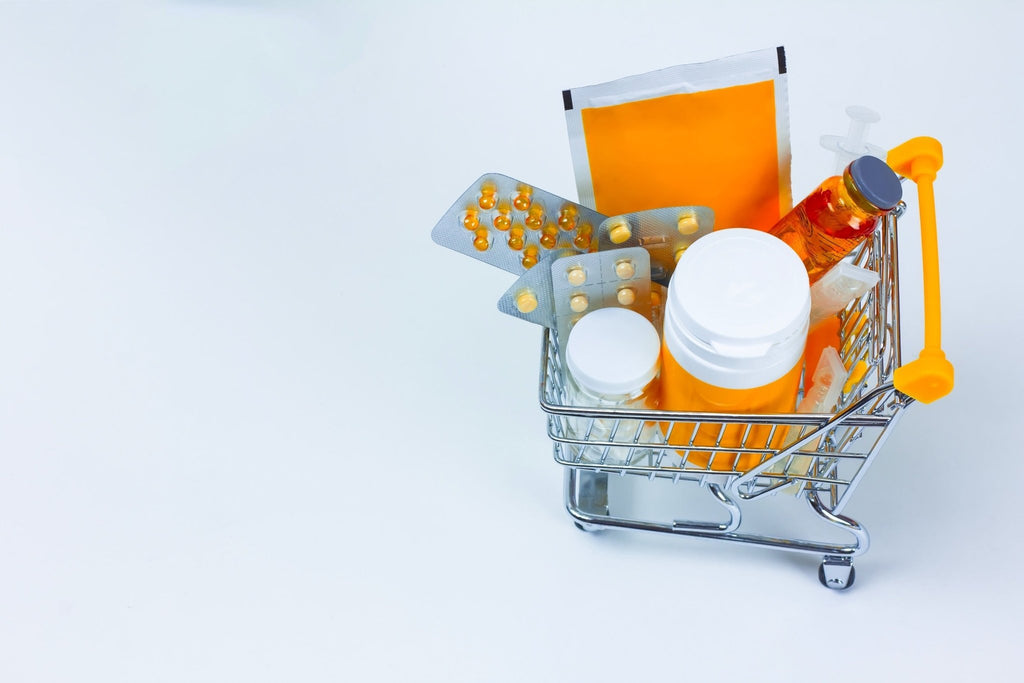 valerian, tablets in plastic packaging in a miniature copy of a shopping cart on a white background